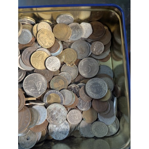 588 - Two tins of British and world coins, gross weight including tins 4.3kg