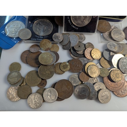 588 - Two tins of British and world coins, gross weight including tins 4.3kg