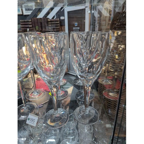 195 - 10x John Rocha Waterford crystal wine glasses. Comprised of 1 set of 6, 1 set of 4. H23cm