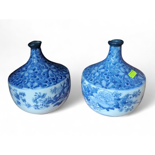 303 - Pair of Japanese blue and white squat vases, unmarked, restored rims, height 18cm