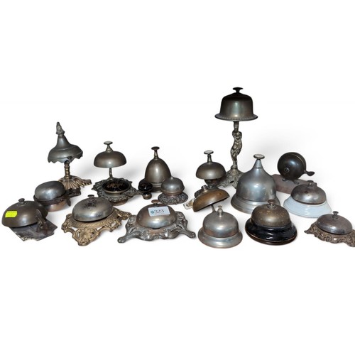 323 - Shelf of various counter top / reception bells and others