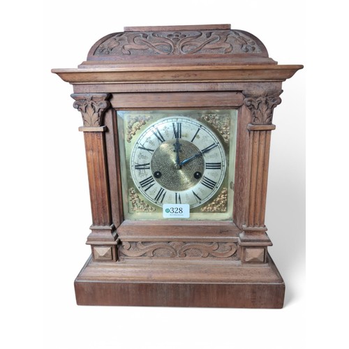 328 - Carved wood cased mantle clock, unmarked, with pendulum, height approx. 38cm