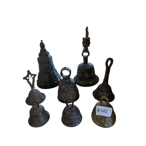 342 - Cast metal ecclesiastical bell and seven various table bells, ecclesiastical bell height 17cm