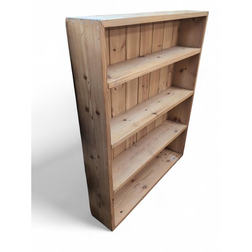 376 - Pine book case on bun feet. W89cm D18cm H112cm.