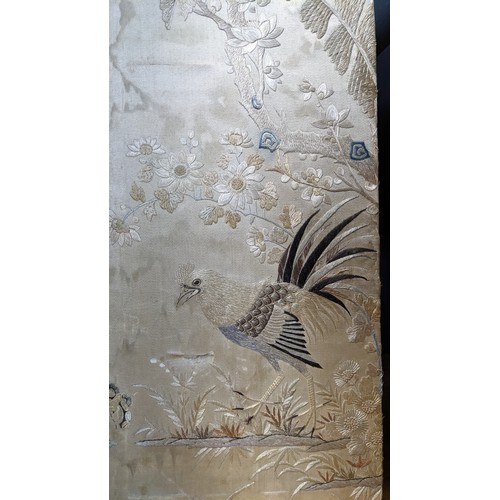 332 - Four Chinese silk embroidered panels depicting flora and birds, each panel 18.5 x 58cm