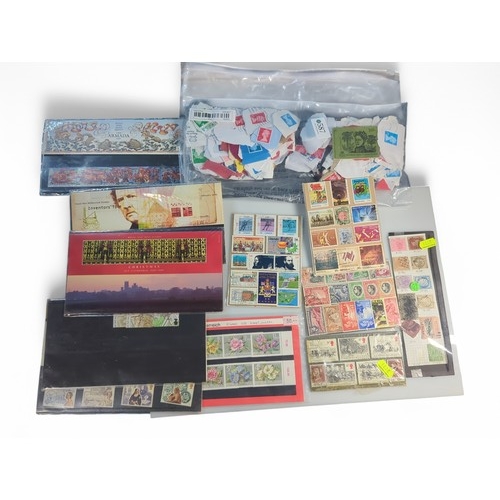 587 - Small quantity of presentation packs and used stamps