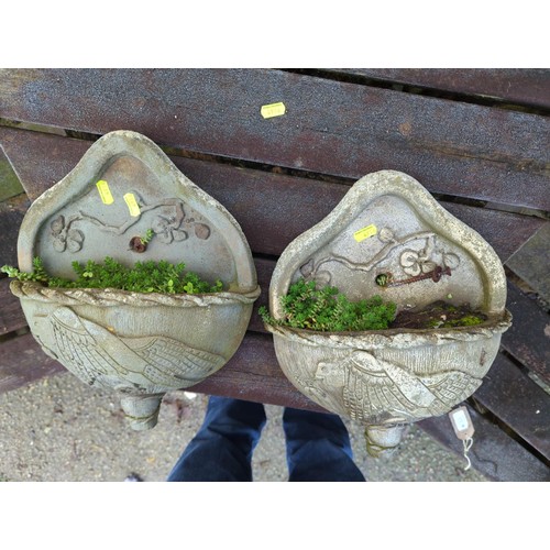 33 - Pair of wall-hanging concrete planters with bird detail. 