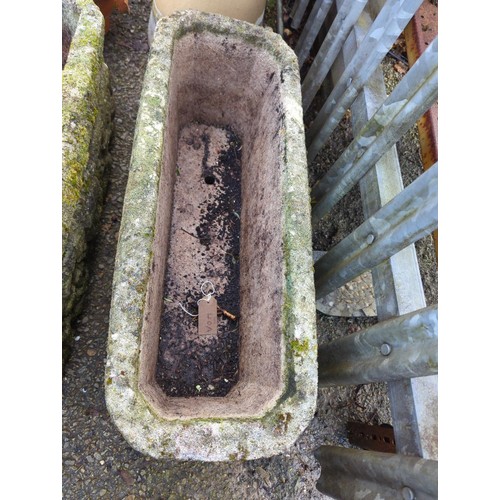 40A - Concrete trough-style planter with lion's face detail to side. W71cm D28cm H25cm.