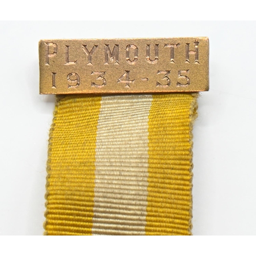 20 - 9ct gold and enamel masonic medal, the 9ct gold pin bar engraved 'Plymouth 1934-35', hallmarked Birm... 