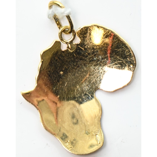 28 - Yellow metal pendant of Africa, marked 750 18K, length including bale 25mm, 1.19 grams