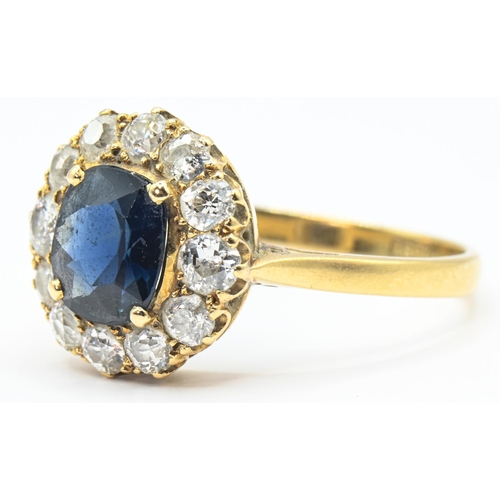 36 - Sapphire and diamond cluster ring, centring a mixed-cut sapphire estimated to weigh 1.73 carats, the... 