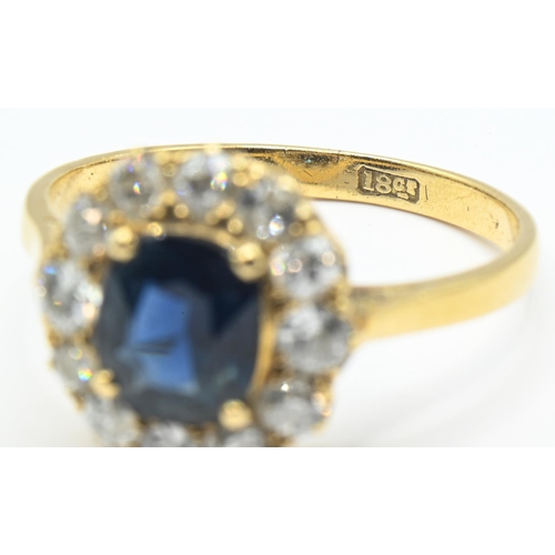 36 - Sapphire and diamond cluster ring, centring a mixed-cut sapphire estimated to weigh 1.73 carats, the... 