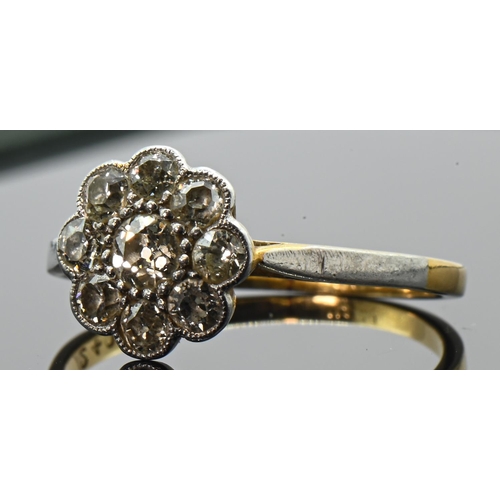 38 - Diamond flowerhead cluster ring, the yellow metal mount stamped 18CT, size N1/2, gross weight 2... 