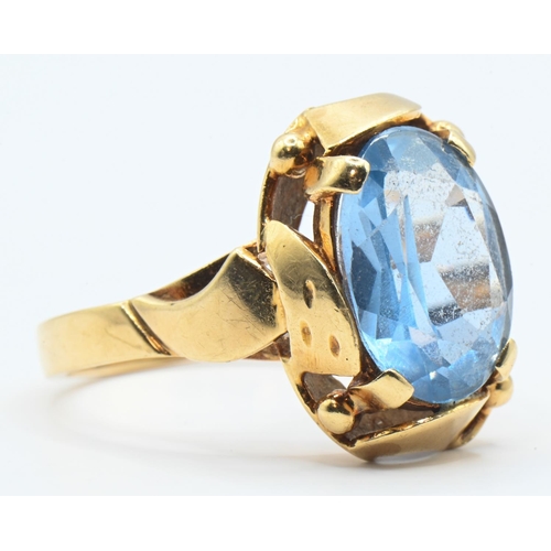 47 - Yellow metal and blue topaz ring, marked 585, tested as 14ct gold, size Q, gross weight 6 grams... 