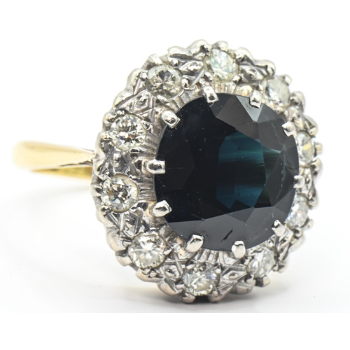 52 - Sapphire and diamond cluster ring, the yellow metal mount stamped 18CT, tested as 18ct gold, size P1... 