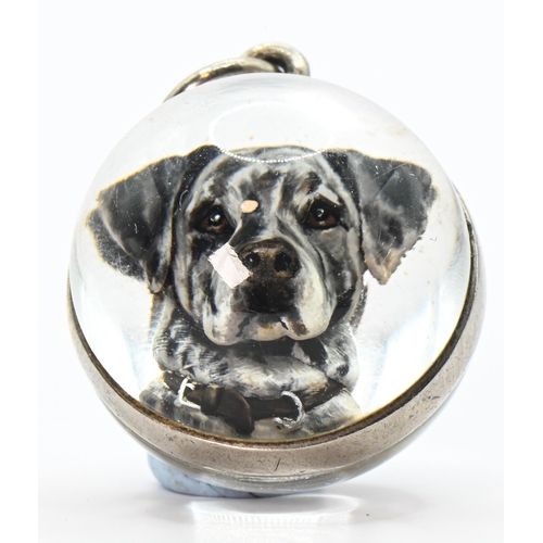 63 - Rock crystal spherical form intaglio pendant of a Great Dane, with an unmarked white metal mount (un... 