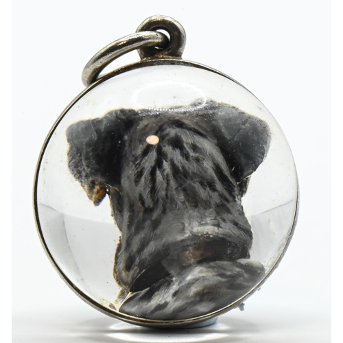 63 - Rock crystal spherical form intaglio pendant of a Great Dane, with an unmarked white metal mount (un... 