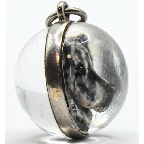 63 - Rock crystal spherical form intaglio pendant of a Great Dane, with an unmarked white metal mount (un... 