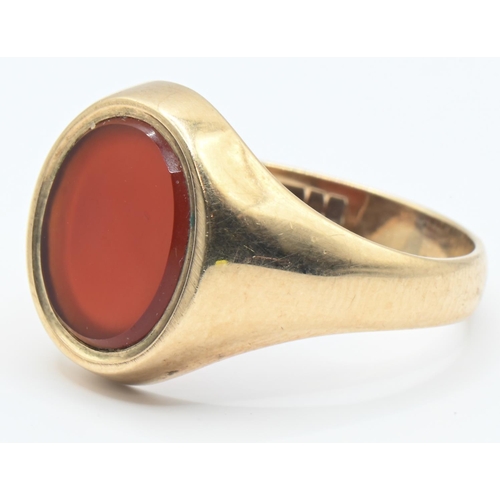 75 - 9ct gold and carnelian signet ring, hallmarked Birmingham 1977, size Q, gross weight 4 grams... 