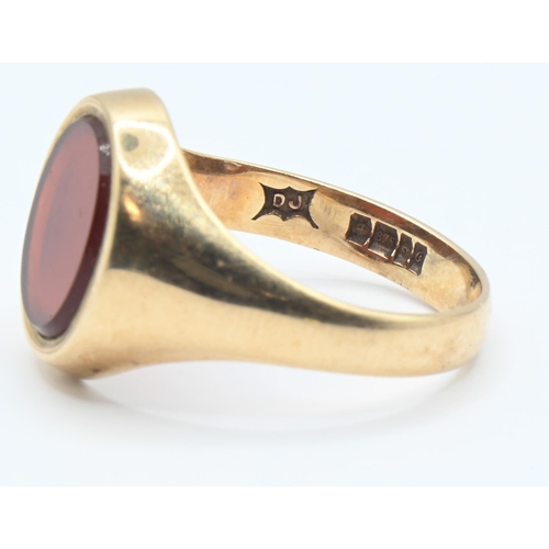 75 - 9ct gold and carnelian signet ring, hallmarked Birmingham 1977, size Q, gross weight 4 grams... 