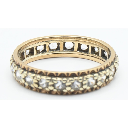 80 - Yellow and white metal eternity ring set with white stones, unmarked, the yellow metal tested as 9ct... 