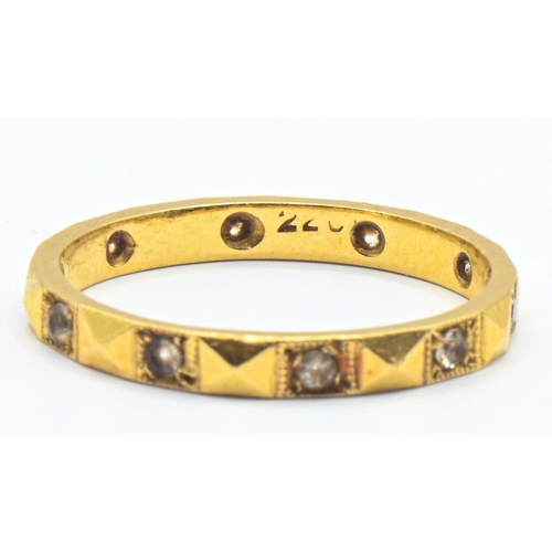 91 - High grade yellow metal and white stone eternity ring, with rubbed mark 22CT, size O1/2, gross weigh... 