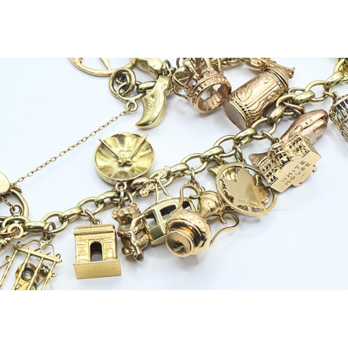 121 - 9ct gold charm bracelet with heart-shaped padlock clasp suspending various charms including hallmark... 