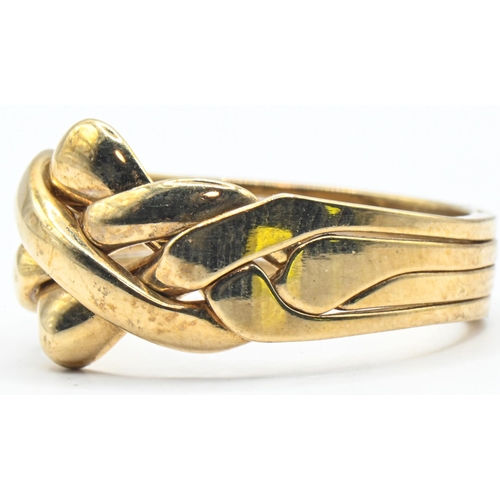 125 - 9ct gold puzzle ring, Sheffield hallmark, size U, 6.38 grams