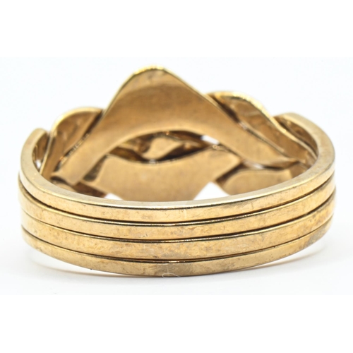 125 - 9ct gold puzzle ring, Sheffield hallmark, size U, 6.38 grams