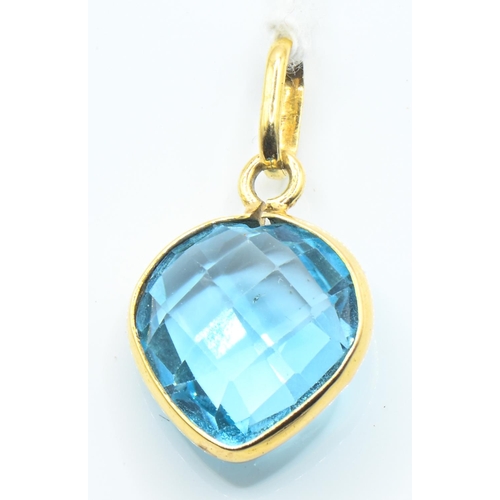 137 - Yellow metal and heart-shaped blue topaz pendant, tested as 14ct gold, length including bale 27mm, g... 