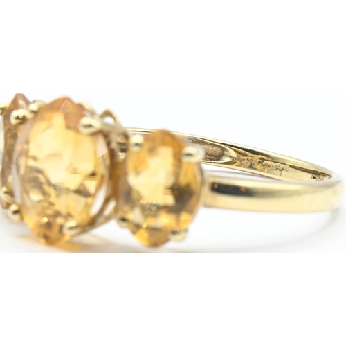 153 - 9ct gold and three stone citrine ring, hallmarked, size Q1/2, gross weight 2.4 grams