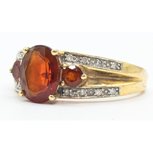 159 - 9ct gold, red stone and diamond ring, hallmarked, size R, gross weight 3.46 grams