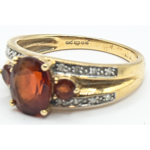 159 - 9ct gold, red stone and diamond ring, hallmarked, size R, gross weight 3.46 grams