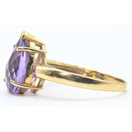 163 - 9ct gold and pear-shaped amethyst ring, hallmarked, size Q1/2, gross weight 2.78 grams