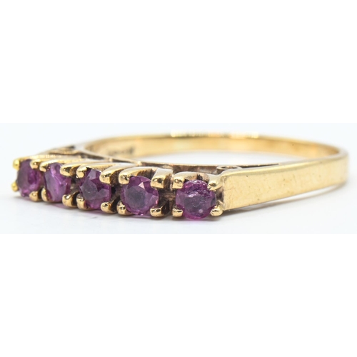 165 - 9ct gold and five stone purple gemstone ring, hallmarked, size R1/2, gross weight 3.18 grams... 