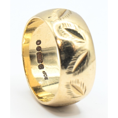 171 - 9ct gold ring, the wide band with a continuous leaf pattern, hallmarked London 1973, size K, 5 grams... 