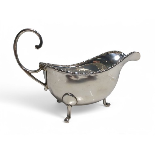 208 - George V silver sauce boat, Walker & Hall, Birmingham 1932, of small proportion with gadroo... 