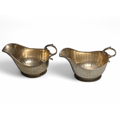 210 - Pair of George V silver sauce boats, Brook & Son, Sheffield 1928, with fluted decoration and ova... 