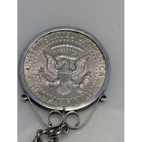 228 - USA 1964 Kennedy half dollar mounted in pendant with chain, gross weight 35.05 grams