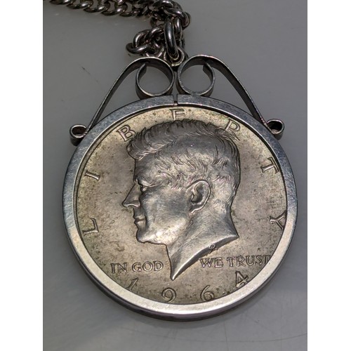 228 - USA 1964 Kennedy half dollar mounted in pendant with chain, gross weight 35.05 grams