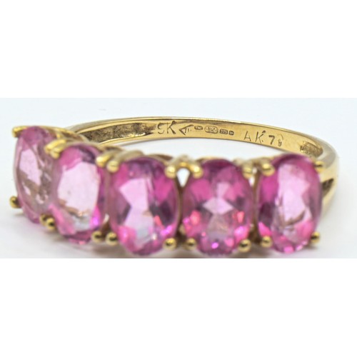 100 - 9ct gold and five stone pink gemstone ring, hallmarked, size Q, gross weight 2.63 grams