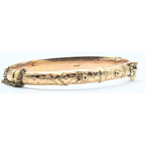 120 - 9ct rose gold buckle design hinged bracelet, hallmarked Chester 1915, with a safety chain, inner dia... 