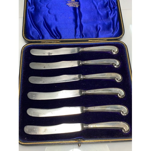 221 - Cased set of hallmarked silver handled pistol grip butter knives and a cased set of George Unite hal... 