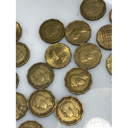 244 - Box of brass threepences gross weight including box 960 grams