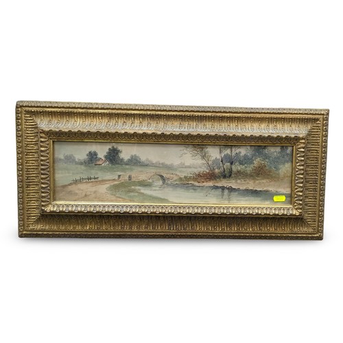 615 - Watercolour view of a country scene, signed lower left Wellman (?), in ornate gilt frame 66.5 x 29cm