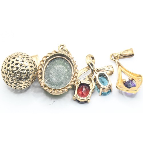 142 - Five assorted pendants, mostly gem-set, including one 9ct gold hallmarked and four yellow metal vari... 