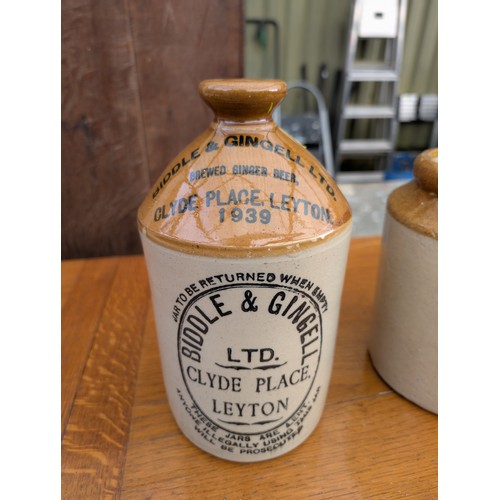 284 - 1 x Stoneware Decanter marked Biddle & Gingell 1 x Stoneware Jar