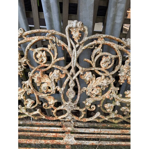 1A - Ornate cast iron garden bench. W186cm D61cm H83cm.