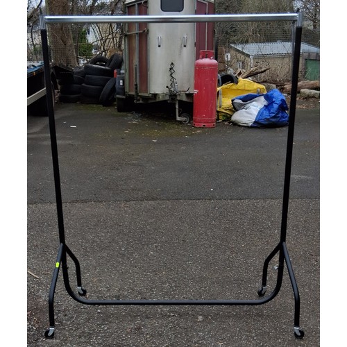 110A - Black metal clothes rail on casters. W122cm D52cm H157cm.