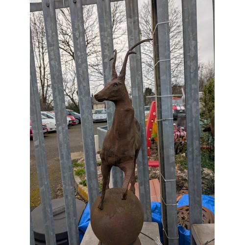 3 - Pair of cast iron stags on sphere bases, dia. 22cm x ht. 89cm approx.